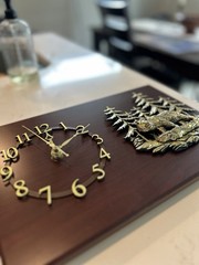Hanging rectangular clock with gold bear and woods details