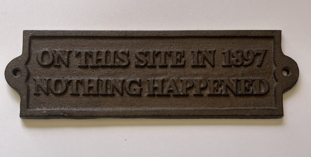 Wall Plaque «On This Site In 1897 Nothing Happened» Cast Iron Brown Sign 9 inch