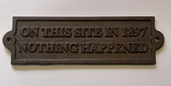 Wall Plaque «On This Site In 1897 Nothing Happened» Cast Iron Brown Sign 9 inch
