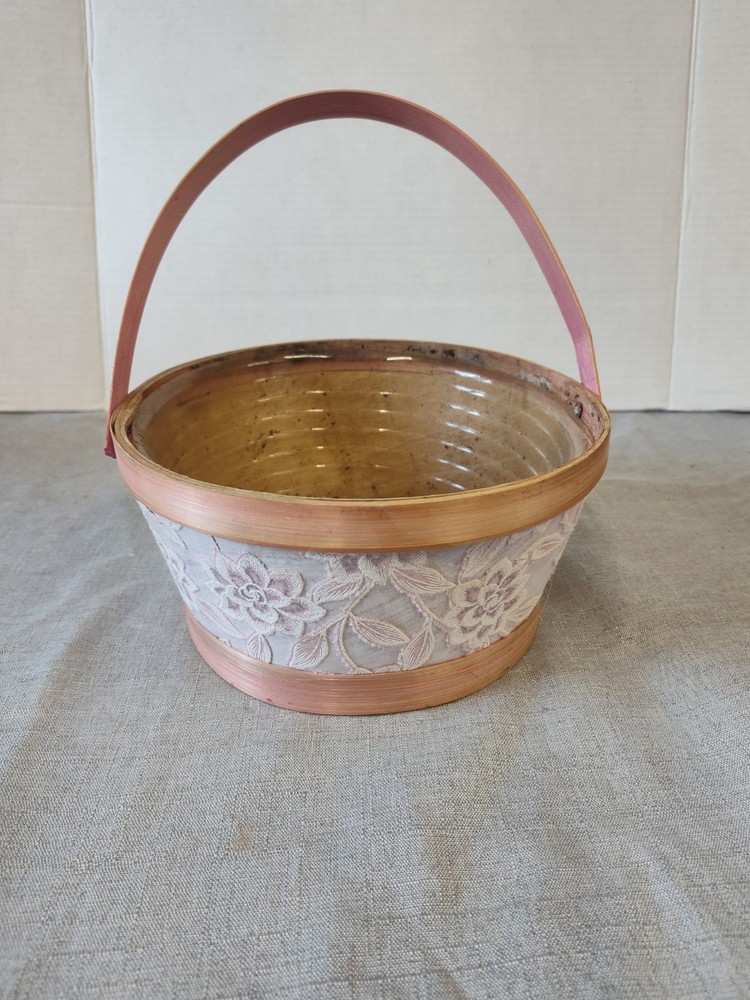 Wicker Basket With Pink Ribbon To Plant Flowers