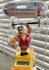 Solar Power Red Weightlifting Man Toy – Car Dash – Office Desk (4 Inches)