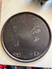 Rustic round cut metal Navajo wall hanging with Kokopelli and Yei