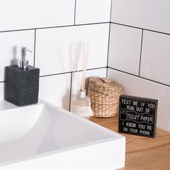 3.94 x inches (0.59 thick), mainly in black with white words