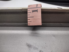 One way metal sign 16 inch long and 1 inch deep with hangers on back.