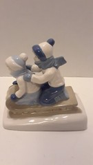 1992 PAUL SEBASTIAN PORCELAIN BOY & GIRL SLEDDERS 6 1/4″ H X 6″ L