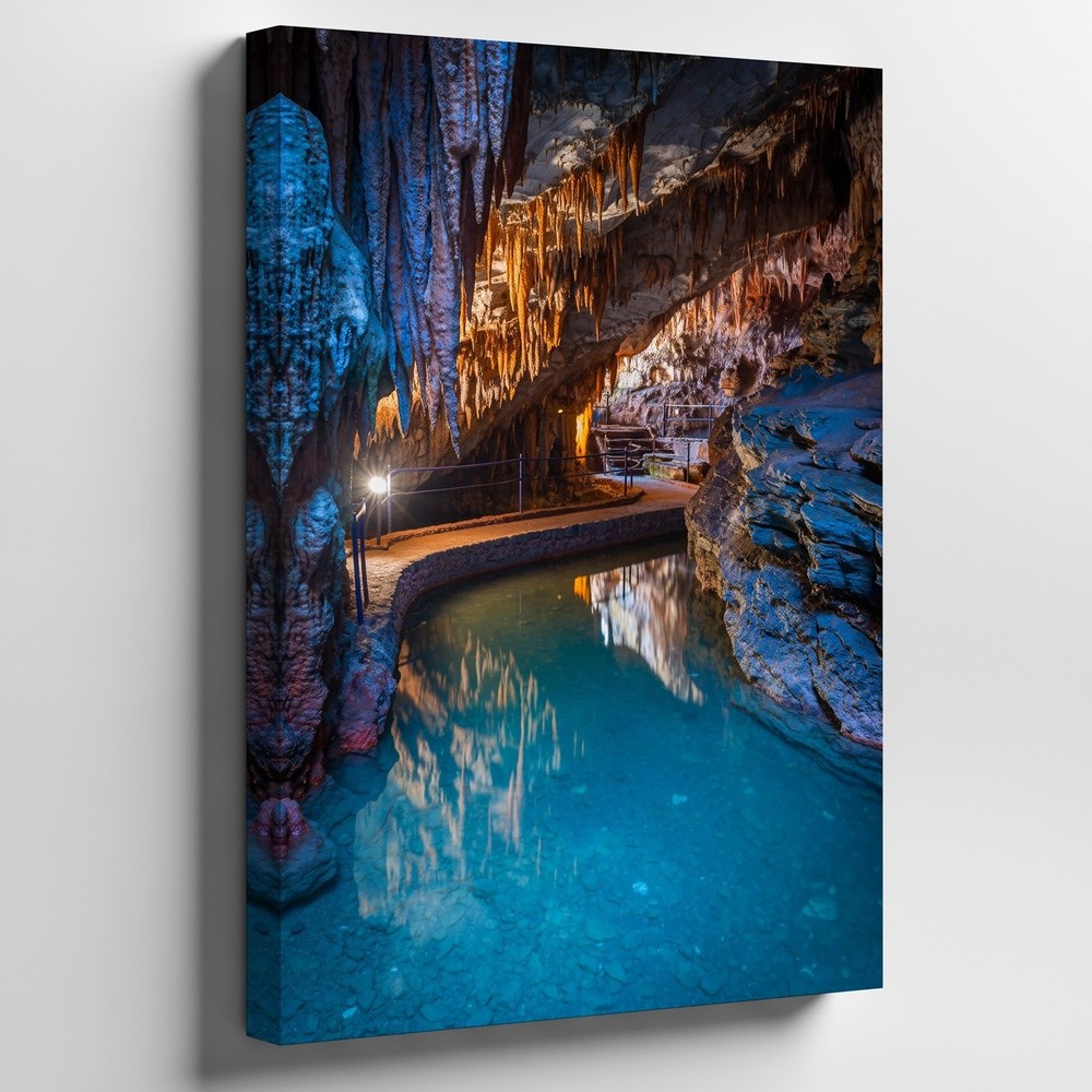 Serene Cave Interior Featuring Dramatic Rock Formations With Elongated Wall Art