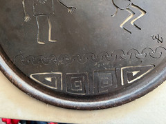 Rustic round cut metal Navajo wall hanging with Kokopelli and Yei