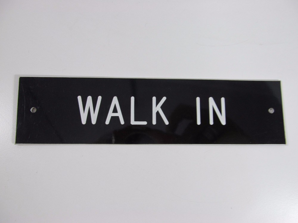 WALK IN SIGN/PLAQUE WALL OR DOOR MOUNTED BLACK PLASTIC 8″ X 2″