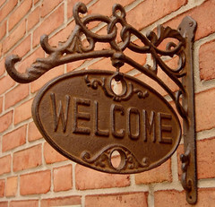 Upper Deck Welcome or Go Away Sign Ornate Cast Iron Front Door Plaque