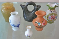 Set of six small vintage vases. Size varies from 1 5/8” to 3 3/4” tall.