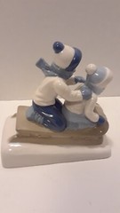 1992 PAUL SEBASTIAN PORCELAIN BOY & GIRL SLEDDERS 6 1/4″ H X 6″ L