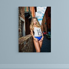 Canvas Art of Elegant Woman Against Brick Wall in Urban Charming Setting
