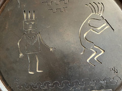 Rustic round cut metal Navajo wall hanging with Kokopelli and Yei
